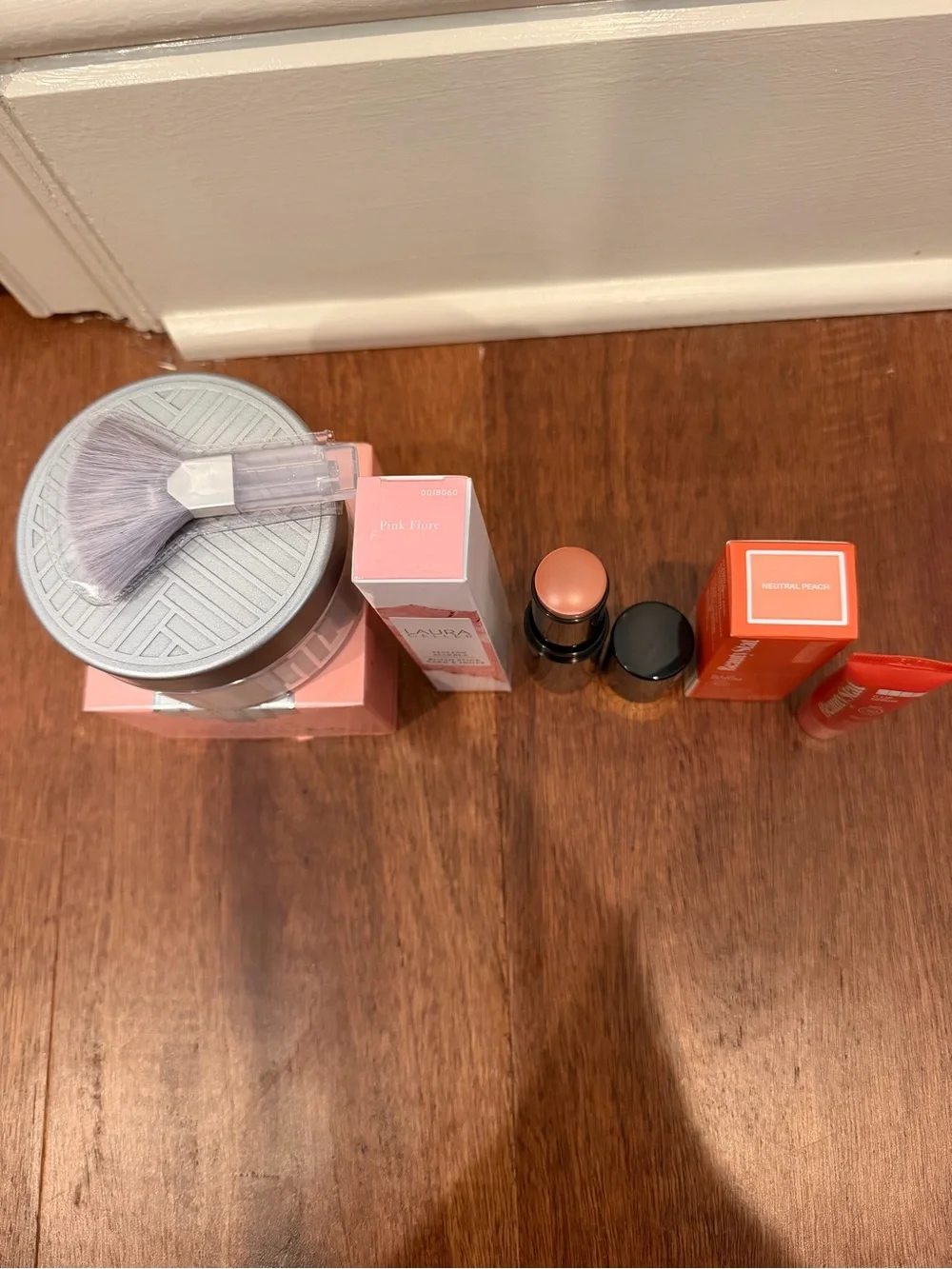 Laura Geller Pink Blush Stick & Lip Serum and charles of the ritz powder